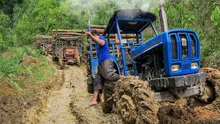 Tractors trying to get out of the mud. Tractors logging in the rainy season