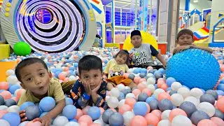PLAYING ON THE SLIDE IN THE PLAYGROUND. BALL POOL, RIDING CARS, PLAYING IN THE SAND