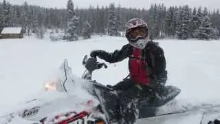 Sarah snowmobiling Vail fox farm up near Piney