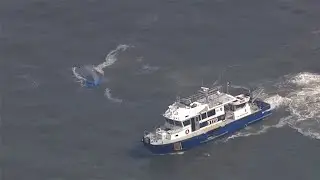Capsized boat in Hudson River [aerial view]