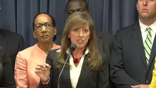 Holmes takes a stand against cuts to child care program
