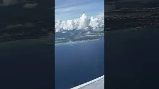 Commercial Flight Window Seat Over The Ocean Waters