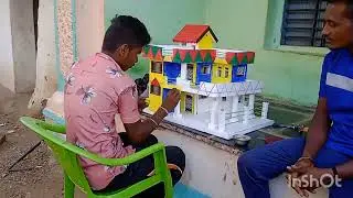 Thermocol house making with glitterl paqer with dimensios school building