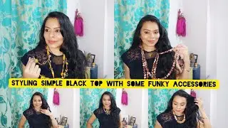 Styling simple black top with some funky accessories