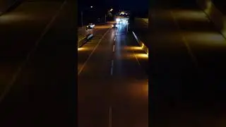 Drone Flying Over Highway at Night