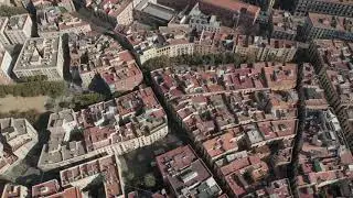 AERIAL: Wide Shot flight over Barcelona on Bright Sunny Day