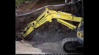 Excavator Digging Rock