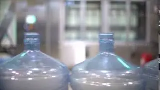Production line. Water bottle conveyor industry. Plastic bottles