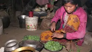 Cooking organic green vegetables in traditional way and eating with food of maize