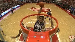 Highlight: Washington men's basketball's Carlos Johnson thrills with this crossover dunk