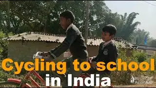 Children Cycle to School in India