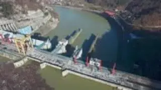 Islands of floating waste clog river in Bosnia