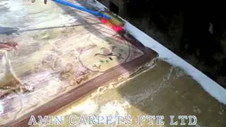 Process of washing Chinese carpet at   Amin  Carpets  Pte Ltd