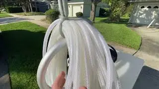 Gutter debris removal and driveway surface cleaning