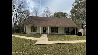 Charming Acadian-Style Home with Expansive Tree-Filled Property!