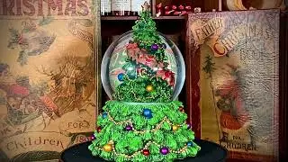 Santa Riding Around Tree Snow Globe &ndash; 19cm Musical Globe