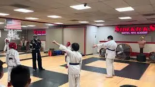 Sidekicks kids martial arts sparring with tournament scoring practice