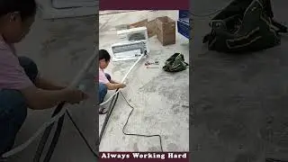The Process Of Applying Insulation Tape To AC Pipe