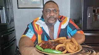 BBQ Ribs and onion rings. The bones fall out like loose teeth.