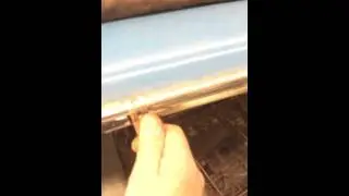 Removing drip rail trim on a 59 Edsel.