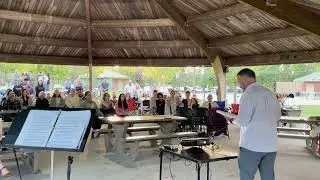 Pastor Eric Stewart speaks during vigil at Physicians Park in Grand Blanc