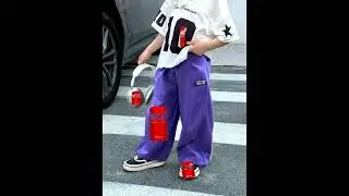 Coka CoLa Purple bell bottom pant and crooked dre headphones with the left side oWn