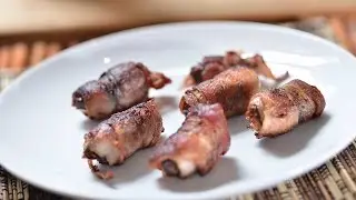 Dates stuffed with almonds and wrapped in bacon