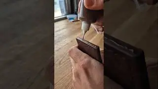 Finishing the edge of a handmade leather wallet - #leather #wallet #leatherwallet #leathercrafting