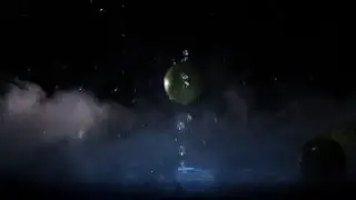 Lime Fruits Falling on Water Surface in Blue Light Spot and Cold Fog Cloud | Stock Footage -