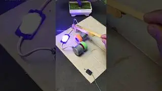 LED lights up from electricity generated by friction between two wheels connected to DC motors