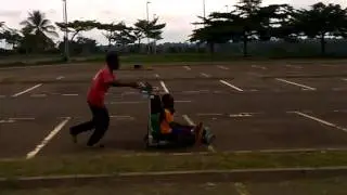 Nsimalen Airport Yaounde summer kids play with airport trolley