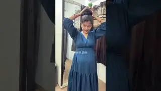 Long hair model showing off her incredible knee length hair in different ways like bun drop ponytail