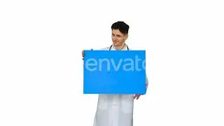 Smiling Male Doctor Wearing a Stethoscope Holding Blank Poster on White Background. | Stock Foot...