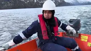 Rescue Boat launching drill in Norway , anlamig boy