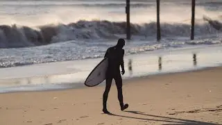 One Surfer Paddling Big Waves and Strong Current at Croatan in Virginia Beach