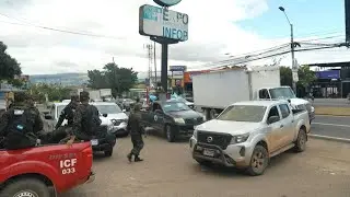 Ballots in Honduras' tightly-contested election transported under heavy military guard | AFP