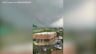 Onlookers catch rotating clouds Tuesday near Independence