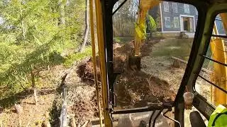 John Deere 190E excavator digging electrical trench.