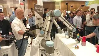 Amazon CEO Jeff Bezos Operates Robot Hands