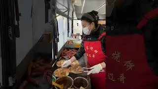 Hardworking lady running food cart and selling meat breads