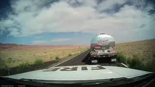 Semi truck dragging chain, sparking alongside road while Dragon Bravo fire was raging nearby.