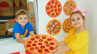 I bambini imparano a cucinare la pizza e ad aiutarsi a vicenda