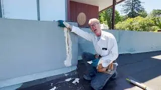 Repair stucco cracks on rooftop parapets