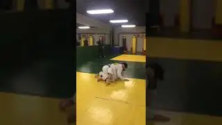 Half guard pass using reverse scarf hold