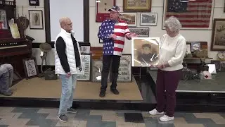 Century-old portrait reunited with family