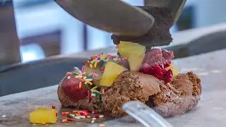 Ice cream mixed with various ingredients on a cold stone plate - korean street food