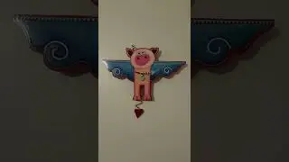 PigClock with swinging pendulum.