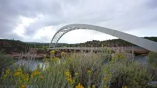 Stock Video - Moving over the brush looking at the Cart Creek Bridge at Flaming Gorge
