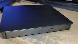 unboxing and installing an ultra thin external optical drive on a laptop without CD player