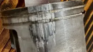 Scored piston on a Stihl MS 500i chainsaw. Employee used straight gas instead of using mixed gas.